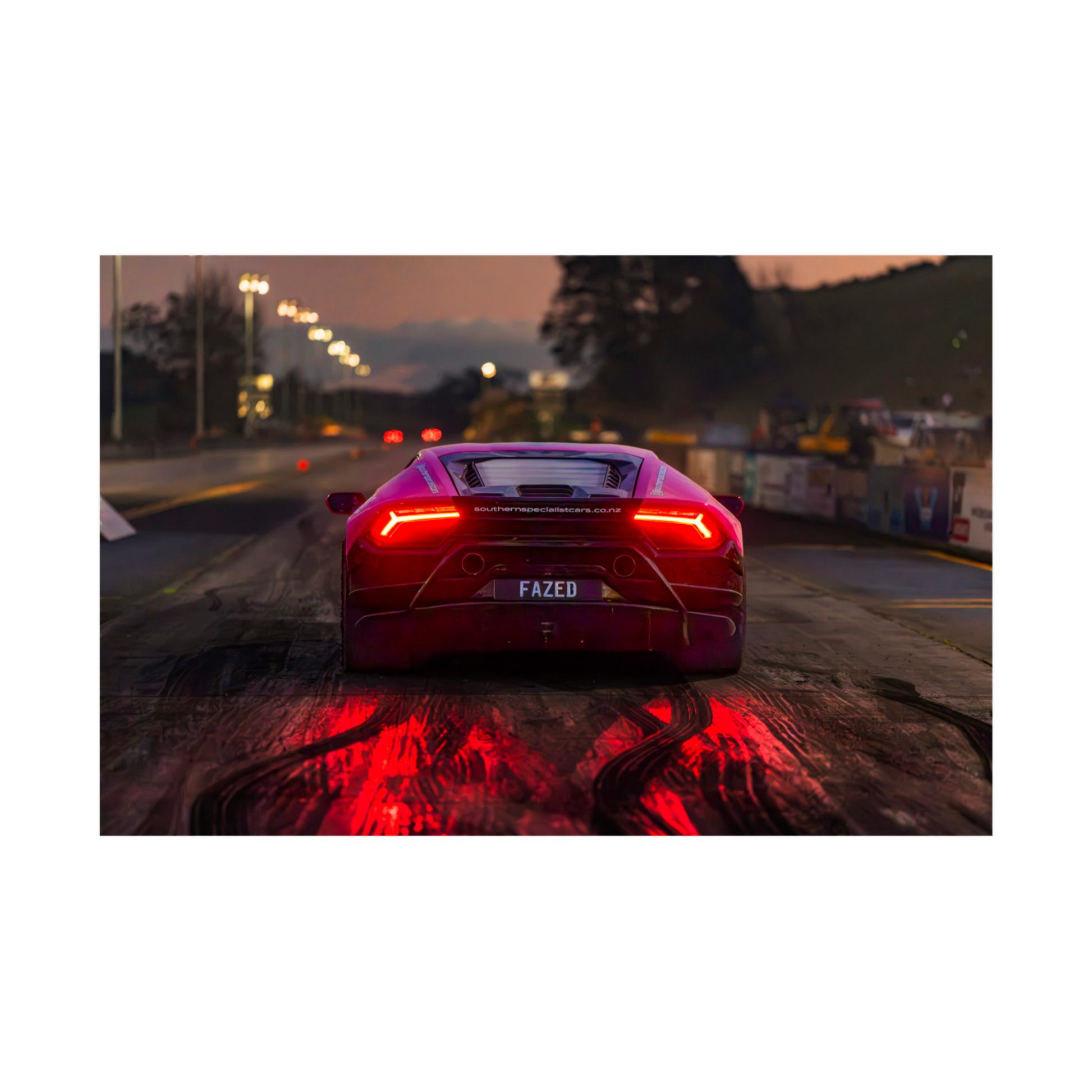 Rear view Lamborghini at dusk with glowing red taillights automotive wall art