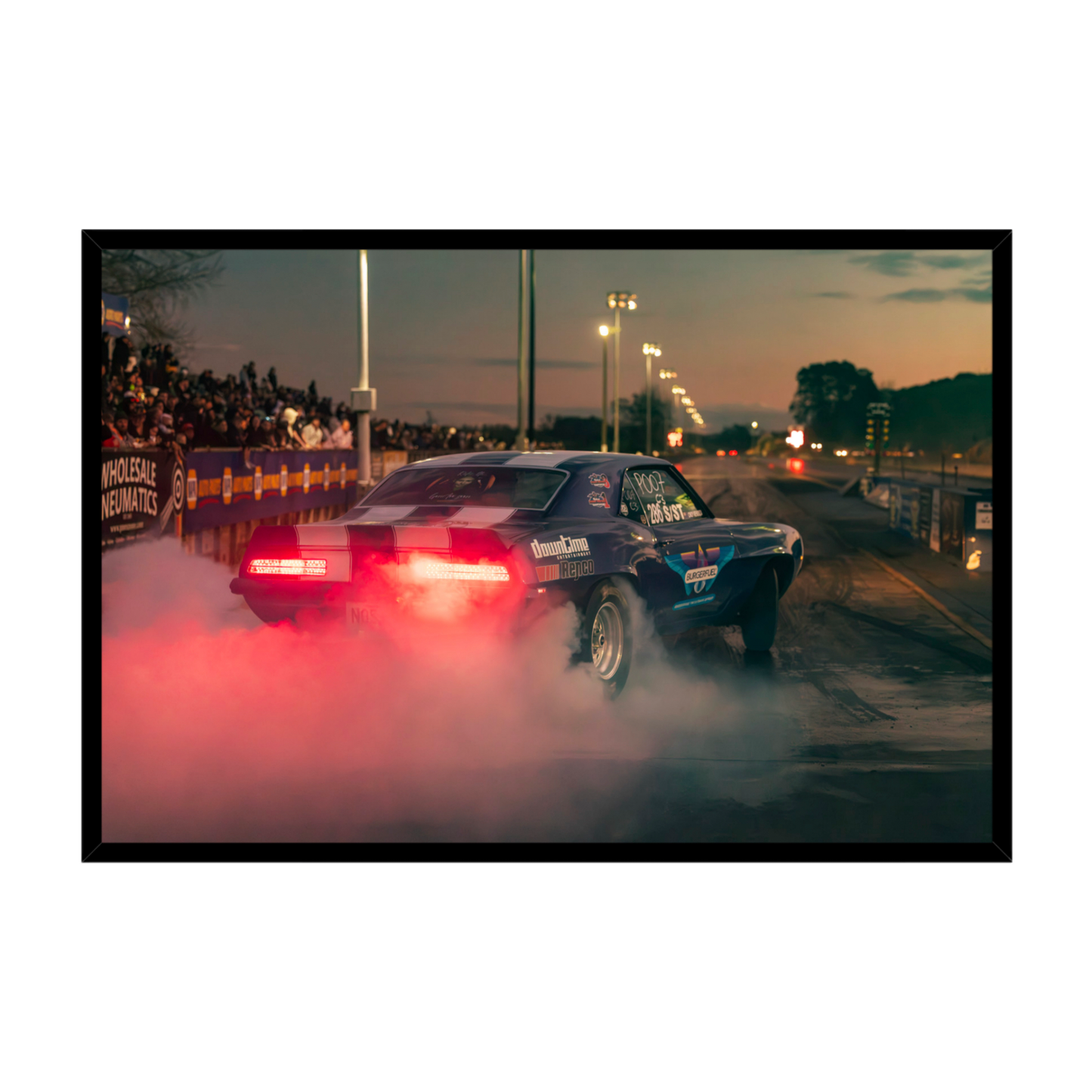 Mendoza Motorsport NZ Chevrolet Camaro drag racing with tyre smoke at dusk