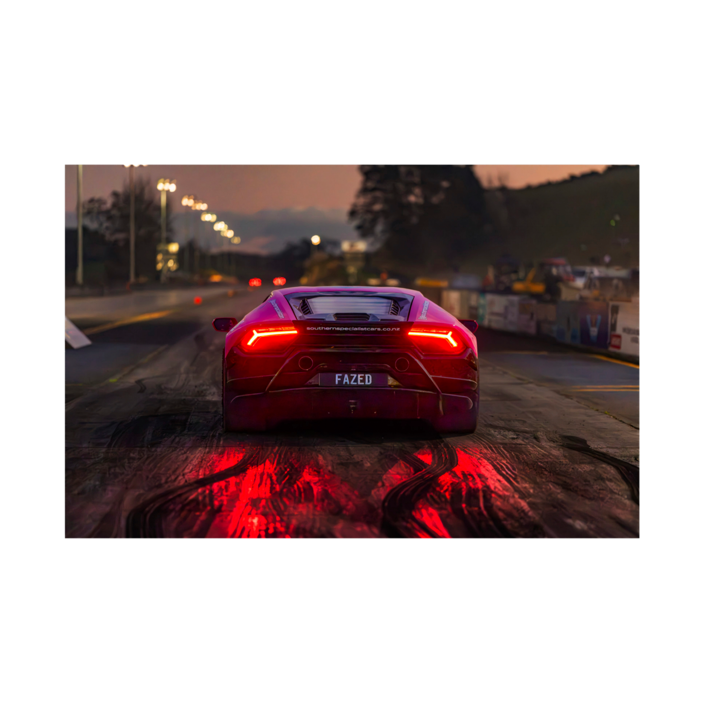 Rear view Lamborghini at dusk with glowing red taillights automotive wall art